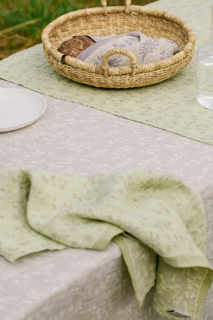 LapuanKankurit-Meirami-linen-cloth-linen-white-and-lime-olive-and-napkin-lime-olive-Salvia-towel-gold-lavender-scaled.webp