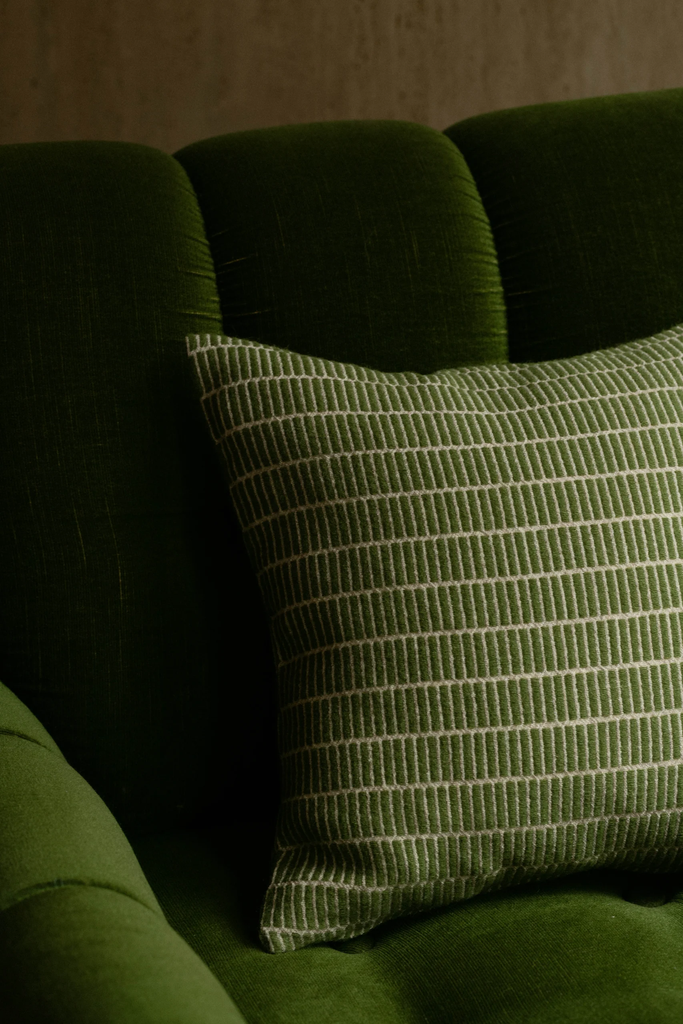 LapuanKankurit-RAITTI-cushion-cover-olive-photocredit-Wilma-Hetemaj-1-scaled.webp